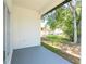 Spacious covered patio overlooking a backyard with greenery and a storage shed at 33 W 7Th St, Apopka, FL 32703