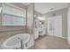A relaxing bathroom featuring a luxurious bathtub, and double sinks at 3304 Bennington Ct, Winter Park, FL 32792