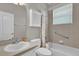 A bathroom features a bathtub and tiled walls at 3304 Bennington Ct, Winter Park, FL 32792