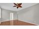 Shows a large bedroom with laminate floors and access to other rooms in the house at 3304 Bennington Ct, Winter Park, FL 32792