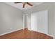 Bedroom featuring laminate floors, a ceiling fan, and a spacious closet for ample storage at 3304 Bennington Ct, Winter Park, FL 32792