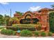 Elegant community sign amidst lush landscaping, enhancing curb appeal at 3304 Bennington Ct, Winter Park, FL 32792