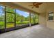 Relaxing screened-in lanai with scenic views of lush greenery and blue skies at 3304 Bennington Ct, Winter Park, FL 32792