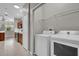 Convenient laundry area with modern appliances, shelving and close to kitchen at 3304 Bennington Ct, Winter Park, FL 32792