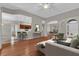 Bright, open-concept living room featuring hardwood floors, modern decor and seamless flow into the kitchen at 3304 Bennington Ct, Winter Park, FL 32792