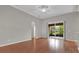 Open living room with wood floors and sliding glass doors to the outdoor space at 3304 Bennington Ct, Winter Park, FL 32792