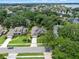 Aerial view of the home showing its positioning within the lot, with mature trees and neighborhood at 3518 Edlingham Ct, Belle Isle, FL 32812