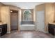 Bathroom featuring a separate shower, soaking tub, and double vanity with a tiled floor at 3518 Edlingham Ct, Belle Isle, FL 32812