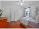 Bedroom with white walls, light trim, hardwood floors and a double-doored closet at 3518 Edlingham Ct, Belle Isle, FL 32812