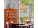 Dining room with hardwood furniture and a view of the greenery outside at 3518 Edlingham Ct, Belle Isle, FL 32812