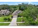 An eye-level aerial view of the home highlighting the lush landscaped yard at 3518 Edlingham Ct, Belle Isle, FL 32812