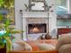 Stone fireplace with white mantel and hearth, perfect for creating a warm and inviting atmosphere at 3518 Edlingham Ct, Belle Isle, FL 32812