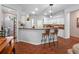 Bright kitchen featuring a bar area and breakfast bar, with adjacent dining area at 3518 Edlingham Ct, Belle Isle, FL 32812