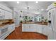Bright white kitchen with stainless steel appliances, breakfast bar, and a tile backsplash at 3518 Edlingham Ct, Belle Isle, FL 32812