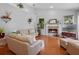 Spacious living room with fireplace, hardwood flooring, and a large mantel with mirror at 3518 Edlingham Ct, Belle Isle, FL 32812