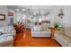 Comfortable living space with hardwood floors and a cozy seating arrangement at 3518 Edlingham Ct, Belle Isle, FL 32812