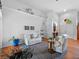 Cozy living room with bright, natural light and comfortable white seating arrangement at 3518 Edlingham Ct, Belle Isle, FL 32812