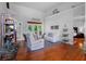 Bright living room with high ceilings, hardwood floors, and comfortable white seating at 3518 Edlingham Ct, Belle Isle, FL 32812