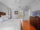 Spacious bedroom with hardwood floors, neutral walls, and plenty of natural light at 3518 Edlingham Ct, Belle Isle, FL 32812