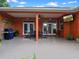 Covered patio area with ceiling fan, TV, seating, and grill, perfect for outdoor entertaining at 3518 Edlingham Ct, Belle Isle, FL 32812