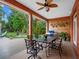 Outdoor patio with ceiling fan, dining table and chairs, perfect for entertaining guests at 3518 Edlingham Ct, Belle Isle, FL 32812