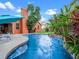 Backyard pool surrounded by lush tropical landscaping and a spacious patio area at 3518 Edlingham Ct, Belle Isle, FL 32812