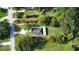 Large lot featuring a charming home in a lush, green setting and an outlined property at 455 Orange Ave, St Cloud, FL 34769