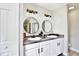 Bathroom featuring a double sink vanity with sleek, modern fixtures at 455 Orange Ave, St Cloud, FL 34769