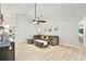 Inviting living room with open layout, fan, and stylish decor, perfect for modern living at 455 Orange Ave, St Cloud, FL 34769
