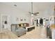 Open living room with vaulted ceiling, fan, and modern decor, creating a welcoming atmosphere at 455 Orange Ave, St Cloud, FL 34769