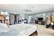 Large main bedroom featuring tile flooring, gray walls, ceiling fan, and king bed at 455 Orange Ave, St Cloud, FL 34769
