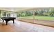 Screened porch overlooking a large, green yard, ideal for relaxation and outdoor enjoyment at 455 Orange Ave, St Cloud, FL 34769
