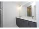 Bathroom featuring double sink vanity, modern fixtures, and large mirror at 506 St Johns Ct, Poinciana, FL 34759