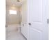 Bright bathroom with marble-style tiles, a white vanity, and a tub-shower combination at 506 St Johns Ct, Poinciana, FL 34759