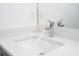 Bathroom sink and countertop details with polished chrome faucet running at 506 St Johns Ct, Poinciana, FL 34759