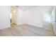 Bright, spacious bedroom featuring light walls and wood-look flooring at 506 St Johns Ct, Poinciana, FL 34759
