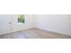 Cozy bedroom featuring light-colored flooring and a window providing ample light at 506 St Johns Ct, Poinciana, FL 34759