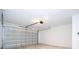Spacious two-car garage featuring a metal door and automatic opener at 506 St Johns Ct, Poinciana, FL 34759