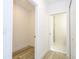 Hallway view of a bathroom and walk-in closet area at 506 St Johns Ct, Poinciana, FL 34759