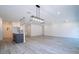 Open-concept kitchen and living room featuring recessed lighting and stylish pendant lights over island at 506 St Johns Ct, Poinciana, FL 34759