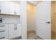 Well-organized pantry with white shelving and ample storage space, with easy access from the kitchen at 506 St Johns Ct, Poinciana, FL 34759
