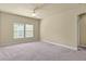 Bright bedroom with neutral walls, carpeted floor, ceiling fan and double windows offering plenty of natural light at 5303 Brady Ln, Orlando, FL 32814