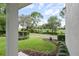 Home's front yard with mature landscaping, green grass, and an inviting entrance at 5303 Brady Ln, Orlando, FL 32814