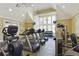 Well-equipped gym with treadmills, weights, and large windows for natural light at 5303 Brady Ln, Orlando, FL 32814