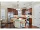 Beautiful kitchen featuring stainless steel appliances, granite countertops, and a central island with bar seating at 5303 Brady Ln, Orlando, FL 32814