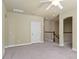 Spacious loft area featuring carpeting, neutral walls, ceiling fan and stairway access at 5303 Brady Ln, Orlando, FL 32814