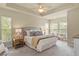 Serene main bedroom featuring a tray ceiling, plush carpeting, and neutral color palette at 5303 Brady Ln, Orlando, FL 32814