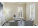 Bright office space with light walls, shuttered windows, and a sleek white desk setup at 5303 Brady Ln, Orlando, FL 32814