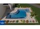 Luxurious pool and spa design with vibrant landscaping at 5303 Brady Ln, Orlando, FL 32814