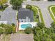 An aerial view showcasing the home, the pool, and the landscaping at 554 Queensbridge Dr, Lake Mary, FL 32746